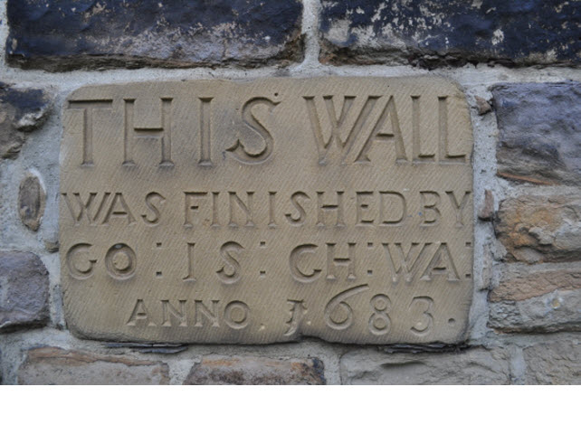 Section of wall bounding All Saints Church Yard on South